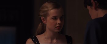 Movie still from “Every Day” (2018), directed by Michael Sucsy – A woman with a ponytail is looking to her left; Close Up shot, Over the shoulder angle