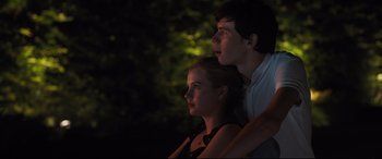 Movie still from “Every Day” (2018), directed by Michael Sucsy – A man and a woman looking up at the sky; Medium shot, Low angle