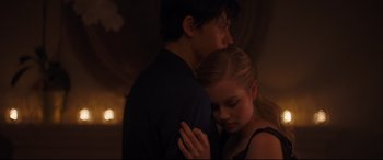 Movie still from “Every Day” (2018), directed by Michael Sucsy – A man and a woman embracing each other in the dark; Medium shot, Low angle