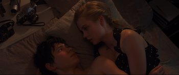 Movie still from “Every Day” (2018), directed by Michael Sucsy – A man and a woman laying in bed together; Close Up shot, Overhead angle