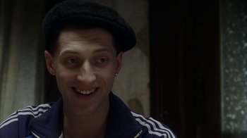 Movie still from “Everything Is Illuminated” (2005), directed by Liev Schreiber – A person wearing a hat; Close Up shot, High angle