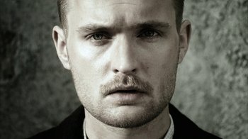 Movie still from “Everything Is Illuminated” (2005), directed by Liev Schreiber – A person with a beard and mustache; Close Up shot, Low angle