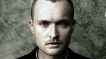 Movie still from “Everything Is Illuminated” (2005), directed by Liev Schreiber – A person with a mustache; Close Up shot, Low angle