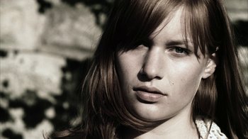 Movie still from “Everything Is Illuminated” (2005), directed by Liev Schreiber – A person with long hair; Close Up shot, Low angle