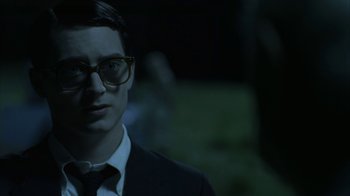 Movie still from “Everything Is Illuminated” (2005), directed by Liev Schreiber – A man in a suit and tie wearing glasses; Close Up shot, Over the shoulder angle