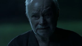 Movie still from “Everything Is Illuminated” (2005), directed by Liev Schreiber – An old man with a beard is looking at the camera; Close Up shot, Low angle