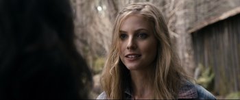 Movie still from “Evil Dead” (2013), directed by Fede Alvarez – A beautiful blonde woman with blue eyes; Close Up shot, Over the shoulder angle