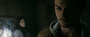 Movie still from “Evil Dead” (2013), directed by Fede Alvarez – A person wearing a hooded jacket; Close Up shot, Low angle