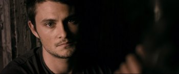 Movie still from “Evil Dead” (2013), directed by Fede Alvarez – A person looking at the camera; Close Up shot, Over the shoulder angle