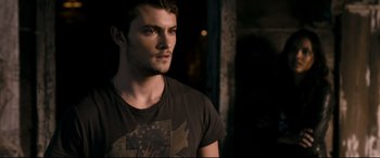 Movie still from “Evil Dead” (2013), directed by Fede Alvarez – A person wearing a t - shirt; Close Up shot, Over the shoulder angle