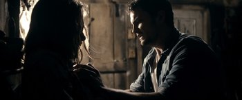 Movie still from “Evil Dead” (2013), directed by Fede Alvarez – A man and a woman looking at one another; Close Up shot, Over the shoulder angle