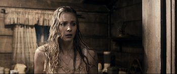 Movie still from “Evil Dead” (2013), directed by Fede Alvarez – A young woman with long hair and a necklace; Close Up shot, Over the shoulder angle