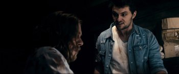Movie still from “Evil Dead” (2013), directed by Fede Alvarez – A man and a woman looking at one another; Close Up shot, Over the shoulder angle