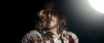 Movie still from “Evil Dead” (2013), directed by Fede Alvarez – A person with long hair; Close Up shot, Overhead angle