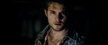 Movie still from “Evil Dead” (2013), directed by Fede Alvarez – A person wearing a shirt; Close Up shot, Over the shoulder angle