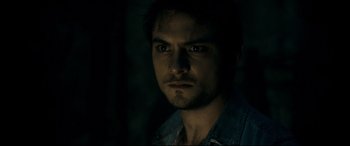 Movie still from “Evil Dead” (2013), directed by Fede Alvarez – A person wearing a shirt; Close Up shot, Over the shoulder angle
