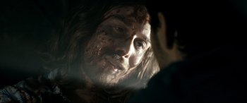 Movie still from “Evil Dead” (2013), directed by Fede Alvarez – A person with a face covered in blood; Close Up shot, Over the shoulder angle