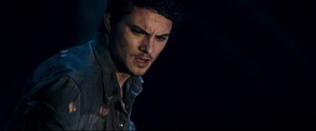 Movie still from “Evil Dead” (2013), directed by Fede Alvarez – A person wearing a shirt; Close Up shot, Over the shoulder angle