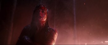 Movie still from “Evil Dead” (2013), directed by Fede Alvarez – A woman with blood all over her face and body; Close Up shot, Low angle