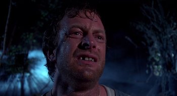 Movie still from “Evil Dead II” (1987), directed by Sam Raimi – A person with a face covered in water; Close Up shot, Low angle