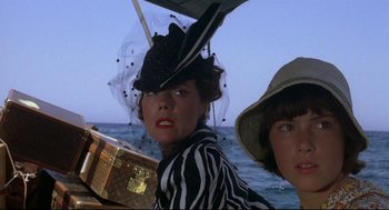 Movie still from “Evil Under the Sun” (1982), directed by Guy Hamilton – Two women in hats on a boat in the ocean; Close Up shot, Low angle
