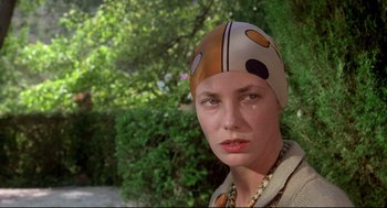 Movie still from “Evil Under the Sun” (1982), directed by Guy Hamilton – A person wearing a hat; Close Up shot, Low angle