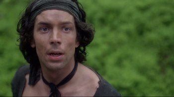 Movie still from “Excalibur” (1981), directed by John Boorman – A person wearing a neck tie; Close Up shot, High angle