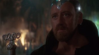 Movie still from “Excalibur” (1981), directed by John Boorman – A person wearing a helmet; Close Up shot, Over the shoulder angle