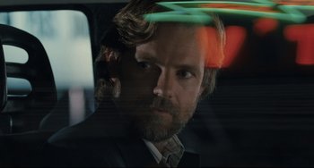 Movie still from “Exotica” (1994), directed by Atom Egoyan – A person in a car; Close Up shot, Low angle