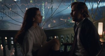 Movie still from “Exotica” (1994), directed by Atom Egoyan – A man and a woman sitting next to each other on a bench; Medium shot, Over the shoulder angle