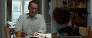 Movie still from “Extremely Loud & Incredibly Close” (2011), directed by Stephen Daldry – A man sitting at a table with a boy; Medium shot, Over the shoulder angle