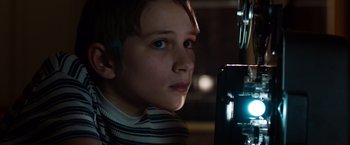 Movie still from “Extremely Loud & Incredibly Close” (2011), directed by Stephen Daldry – A young boy is looking at the camera; Close Up shot, High angle