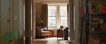 Movie still from “Extremely Loud & Incredibly Close” (2011), directed by Stephen Daldry – A living room filled with furniture next to a large window; Wide shot, High angle