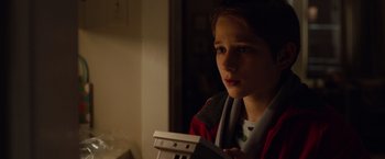 Movie still from “Extremely Loud & Incredibly Close” (2011), directed by Stephen Daldry – A young boy is looking at the camera; Close Up shot, High angle