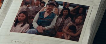 Movie still from “Extremely Loud & Incredibly Close” (2011), directed by Stephen Daldry – An older woman sitting in a group of people on a bus; Extreme Close Up shot, High angle