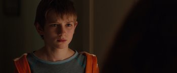 Movie still from “Extremely Loud & Incredibly Close” (2011), directed by Stephen Daldry – A young boy is looking into a mirror; Close Up shot, Over the shoulder angle