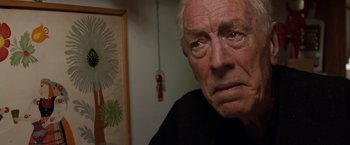 Movie still from “Extremely Loud & Incredibly Close” (2011), directed by Stephen Daldry – An older man with a sad look on his face; Close Up shot, Over the shoulder angle