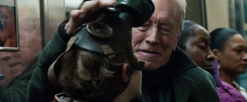 Movie still from “Extremely Loud & Incredibly Close” (2011), directed by Stephen Daldry – An older man and a young boy wearing gas masks; Close Up shot, Over the shoulder angle