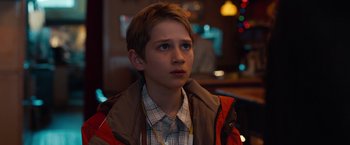 Movie still from “Extremely Loud & Incredibly Close” (2011), directed by Stephen Daldry – A young boy is sitting in front of a window; Close Up shot, Over the shoulder angle