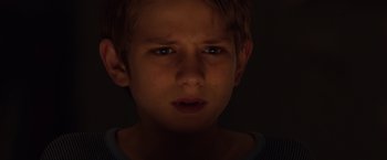 Movie still from “Extremely Loud & Incredibly Close” (2011), directed by Stephen Daldry – A young boy is looking into the camera; Close Up shot, High angle