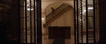 Movie still from “Extremely Loud & Incredibly Close” (2011), directed by Stephen Daldry – A person walking up the stairs of a building; Extreme Wide shot, High angle
