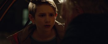 Movie still from “Extremely Loud & Incredibly Close” (2011), directed by Stephen Daldry – A young boy is looking at a older woman; Close Up shot, Over the shoulder angle