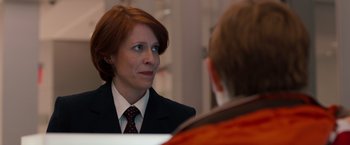 Movie still from “Extremely Loud & Incredibly Close” (2011), directed by Stephen Daldry – A woman wearing a suit and tie talking to a man; Close Up shot, Over the shoulder angle