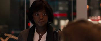 Movie still from “Extremely Loud & Incredibly Close” (2011), directed by Stephen Daldry – A black woman with short black hair wearing a brown jacket; Close Up shot, Over the shoulder angle