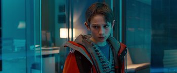 Movie still from “Extremely Loud & Incredibly Close” (2011), directed by Stephen Daldry – A young boy in a red and orange jacket; Close Up shot, Over the shoulder angle