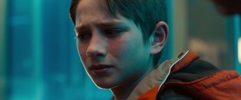 Movie still from “Extremely Loud & Incredibly Close” (2011), directed by Stephen Daldry – A young boy is looking at the camera; Close Up shot, Over the shoulder angle