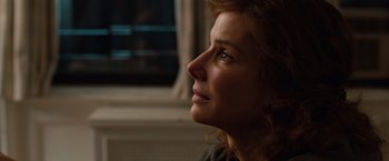 Movie still from “Extremely Loud & Incredibly Close” (2011), directed by Stephen Daldry – A person looking out of a window; Close Up shot, Over the shoulder angle