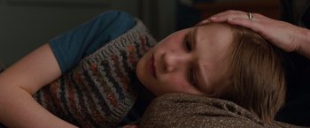 Movie still from “Extremely Loud & Incredibly Close” (2011), directed by Stephen Daldry – A person laying on a blanket; Close Up shot, High angle