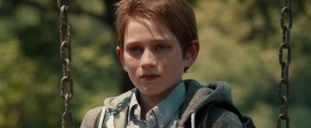 Movie still from “Extremely Loud & Incredibly Close” (2011), directed by Stephen Daldry – A person wearing a shirt and jacket; Close Up shot, Over the shoulder angle