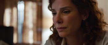 Movie still from “Extremely Loud & Incredibly Close” (2011), directed by Stephen Daldry – A woman's face looking at the camera; Close Up shot, Over the shoulder angle